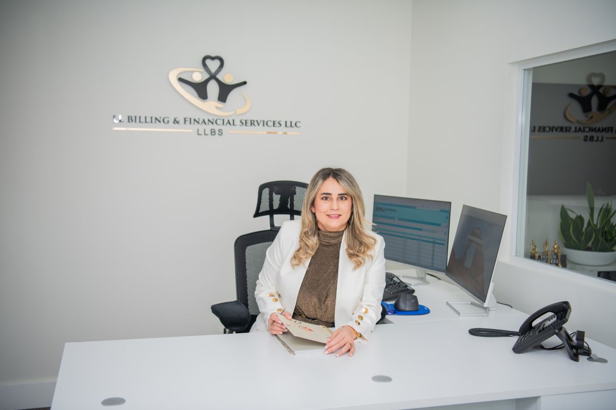 Lisbet Rodriguez, co-founder of LL Billing & Financial Services, at her desk